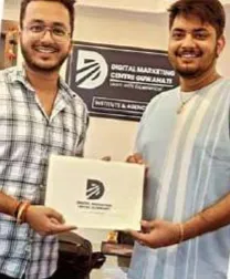A DMCG student receiving a certificate from Ankur Agarwal